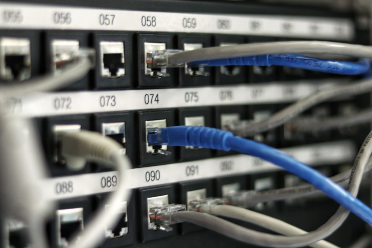 Ethernet cable plugged directly into a laptop for an accurate wired speed test